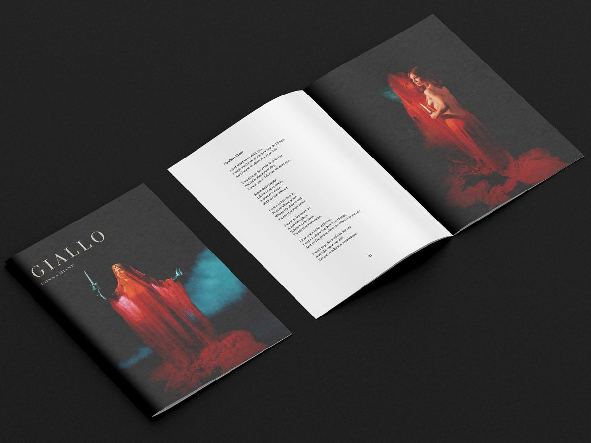 An open book titled Giallo by Donna Diane on a black surface, featuring a poem on the left page and a woman in a red veil holding a dagger on right.