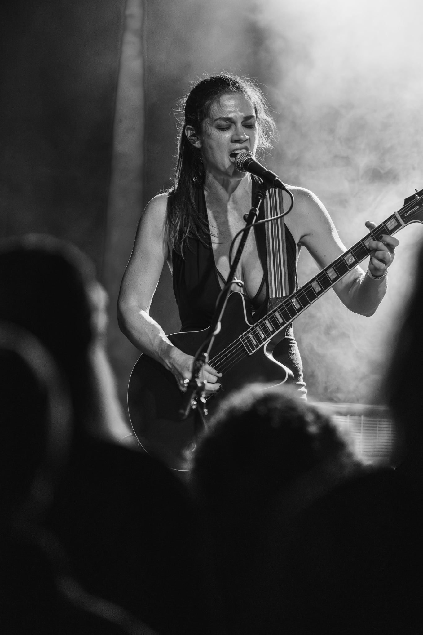 Djunah band singer guitarist Donna Diane playing guitar at a live show for Djuna