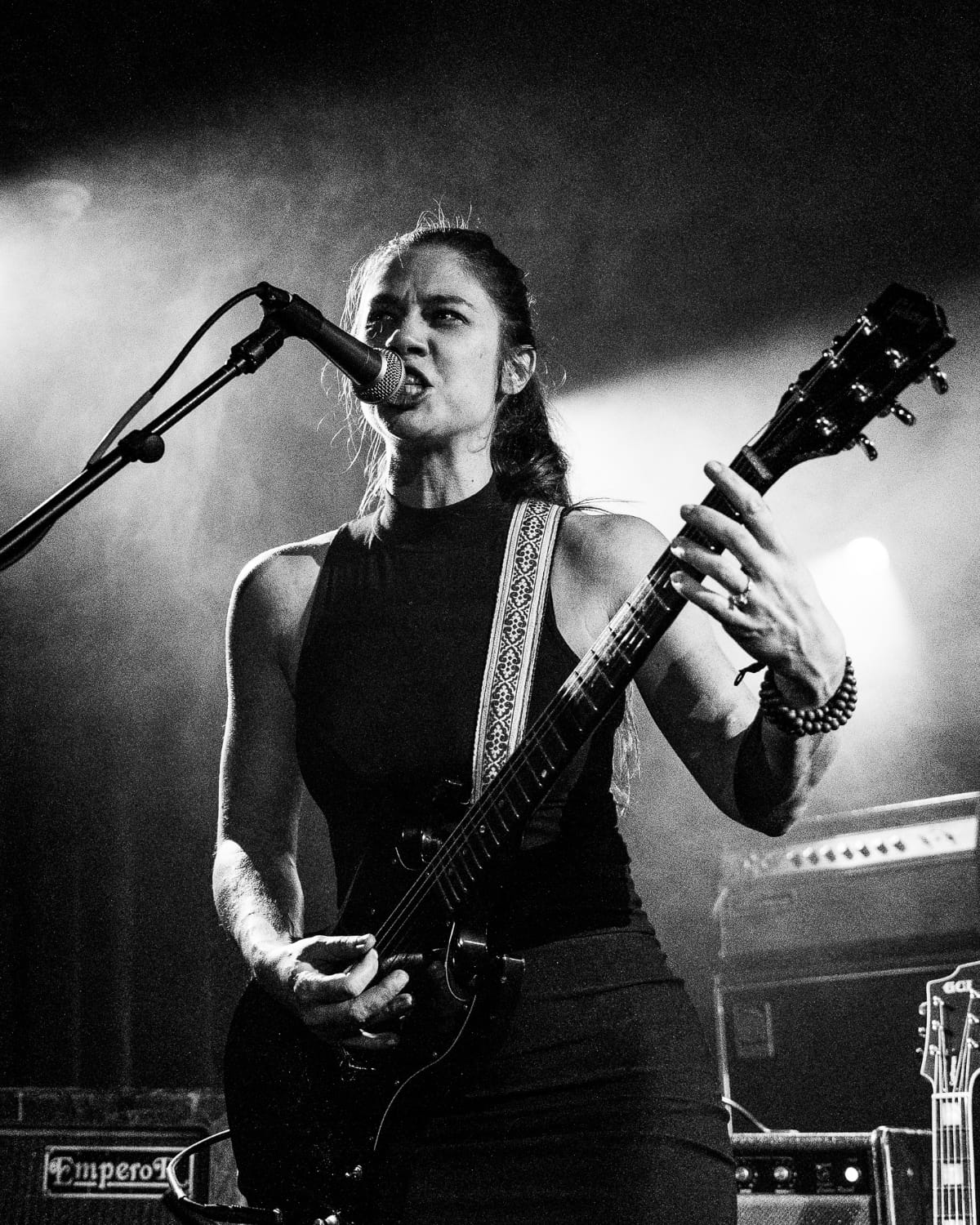 Singer Donna Diane of the band Djunah playing an SG guitar at a live performance