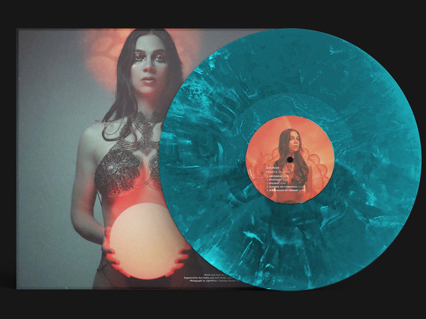 Djunah "Femina Furens" second pressing 12"  LP on deep ocean swirl vinyl, reverse cover, pressed by Smashed Plastic in Chicago, Illinois
