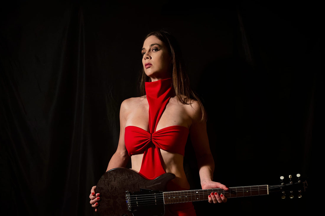 Donna Diane Guitarist of Djunah red dress studio portrait with Furlan Les Paul Double Cut guitar