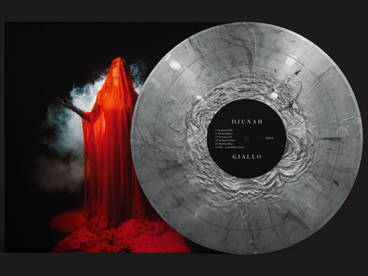 A silver vinyl record with black marbling sits beside an album cover of a woman draped in a flowing red veil, surrounded by wisps of smoke against black. The label reads Djunah, Giallo